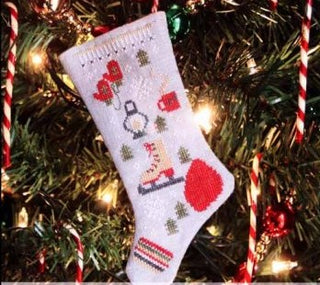 Skate Fever Stocking Ornament 6 Cross Stitch Pattern by Heartstring Samplery *NEW* - Premium Pattern, Cross Stitch from Heartstring Samplery - Just $10! Shop now at Crossed Hearts Needlework & Design