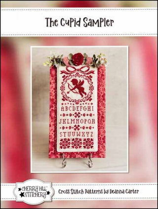 The Cupid Sampler Cross Stitch Pattern by Cherry Hill Stitchery *NEW* - Premium Pattern, Cross Stitch from Cherry Hill Designs - Just $13! Shop now at Crossed Hearts Needlework & Design